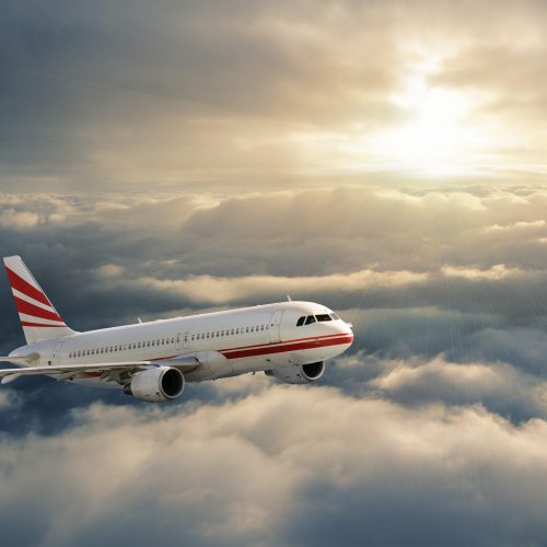Airplane in the sky at sunset