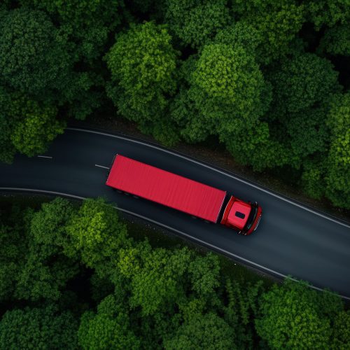 Aerial view of a red heavy truck driving along a narrow road cutting through a dense forest, the truck’s bright color contrasting against the dark green of the trees and the earthy brown road, the trees creating a canopy above, filtering soft sunlight onto the truck, the forest dense and lush, with the road winding through it, creating a sense of isolation and adventure, the atmosphere feels peaceful yet purposeful, photography, the image will use a high-angle lens to capture the full scope of the truck and surrounding forest, with focused lighting to highlight the truck's movement on the road, --chaos 10 --ar 16:9 --profile qb43wh3 --stylize 150 --v 6.1 Job ID: 7eabc9cd-d06c-42e1-8e34-aa54f4e723ef